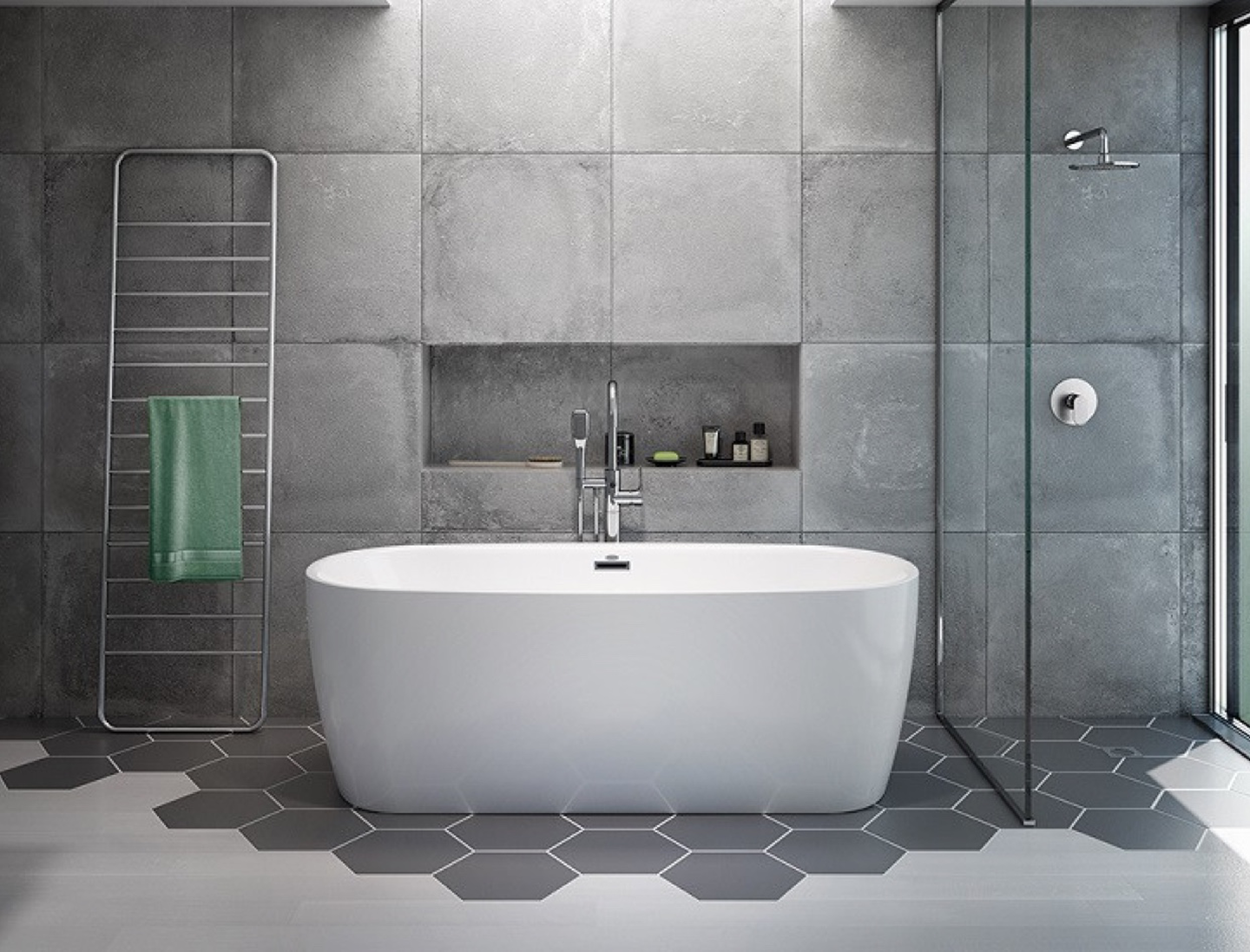 free-standing bath tub on grey hex tiles
