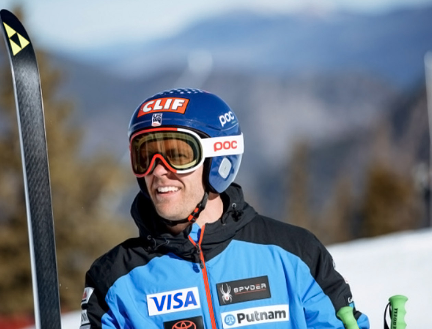 J-585 hot tub with firepit at night