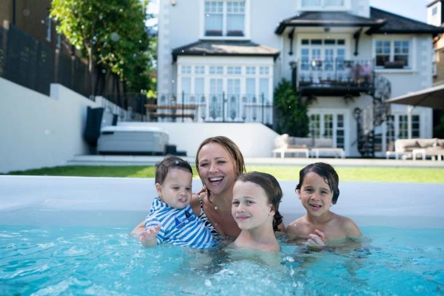 Kimberley Walsh swim spa with the family