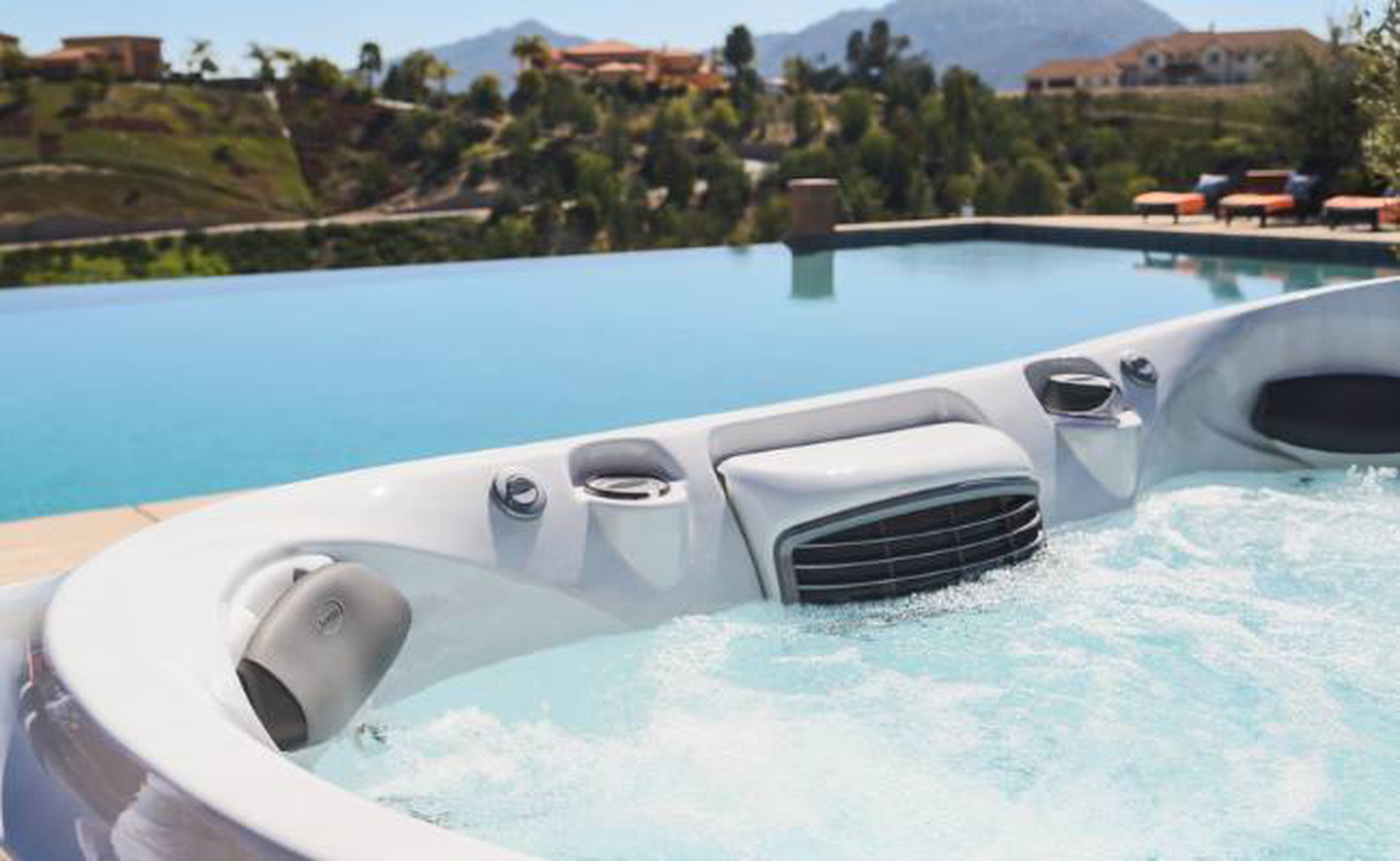 Jacuzzi&reg; hot tub near a pool